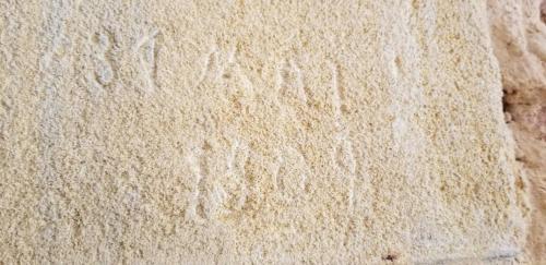 a close up of a piece of bread with footprints in it at MOULIN DE L'HOSTE in Larzac