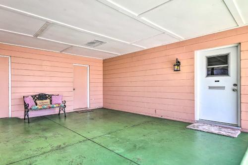 an empty room with a pink wall and a door at Pool Access Ranch-Style House in Sun City Center in Sun City Center