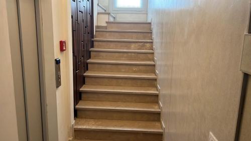a stairway leading up to a door at FORESTERIA SOCIALE VENICE SAN MARCO by NEW GENERATION HOSTEL in Venice