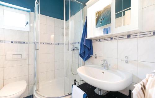 a bathroom with a sink and a shower and a toilet at Beautiful Apartment In Jadrija With 4 Bedrooms And Wifi in Jadrija