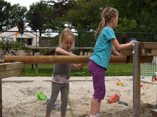 two young girls playing in a playground at Hotel Lemmenhof in Ell