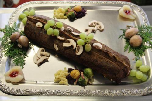 a plate with two different types of food on it at Hotel-Restaurant Alpina in Innertkirchen