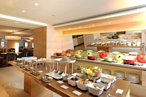 a buffet in a restaurant with a lot of food at Hotel COZZI Zhongxiao Taipei in Taipei