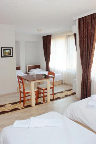 Ένα ή περισσότερα κρεβάτια σε δωμάτιο στο Family Hotel Aleks