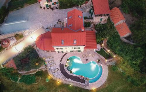 an aerial view of a house with a swimming pool at 7 Bedroom Gorgeous Home In Grabovac in Grabovac