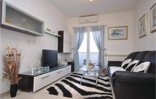 TV a/nebo společenská místnost v ubytování Apartment Supetar Ive Vojnovica