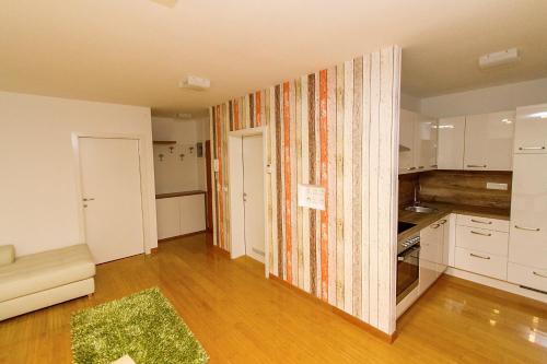 a room with a kitchen and a living room at Apartments Bohinjskih 7 in Bohinj