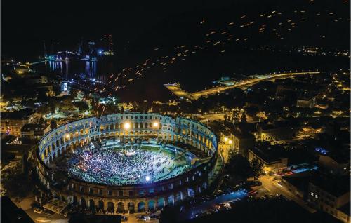 an aerial view of a stadium at night at Apartment Valtursko Polje I in Loborika