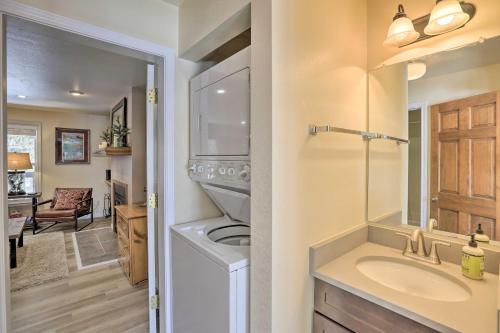 een badkamer met wastafel en wasmachine bij Walk to Marina Rustic Grand Lake Retreat! in Grand Lake