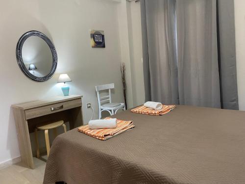 Postel nebo postele na pokoji v ubytování Alexander Apartments