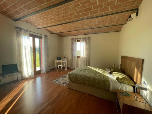 Postel nebo postele na pokoji v ubytování PODERE GRETANO casetta in maremma