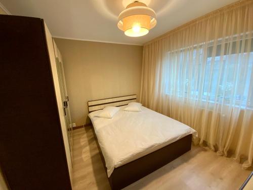 Ένα ή περισσότερα κρεβάτια σε δωμάτιο στο Apartament BELLA