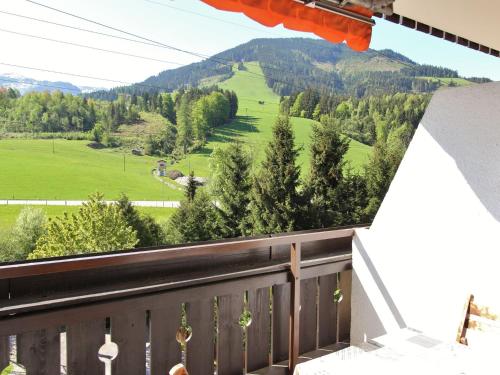 a balcony with a view of a green field at Apartment in Maria Alm near ski area in Maria Alm am Steinernen Meer