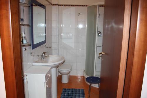 a bathroom with a sink and a toilet at Bed and Breakfast Luna Chiara in Piazza Armerina