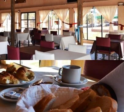 a table with a plate of bread and a cup of coffee at Don Remo in Villa Unión