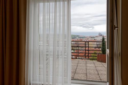 a window with a view of a city at Clarion Hotel Prague Old Town in Prague