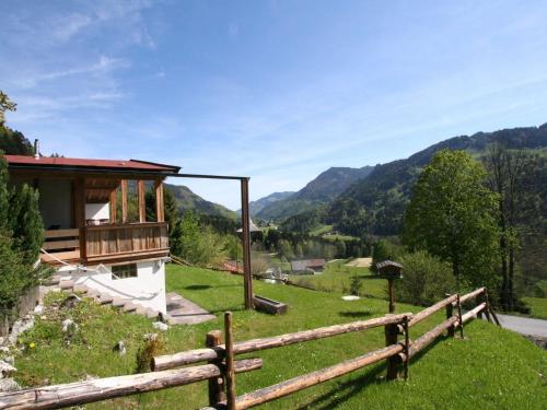 a house on a hill with a fence at Chalet in Kufstein near Ski School in Niederndorferberg