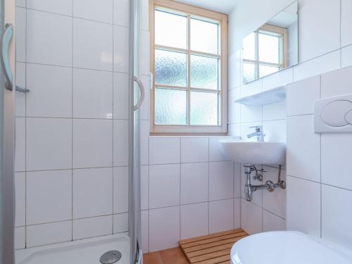 a bathroom with a shower and a toilet and a sink at Spacious Villa in Zell am See near Ski Area in Zell am See
