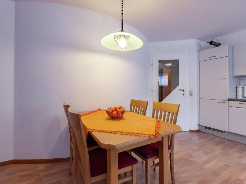 a kitchen and dining room with a table and chairs at Holiday home near the ski area in Vandans in Vandans