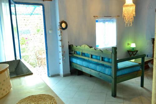a room with a blue crib in a room at Fanari Stone House in Komotini