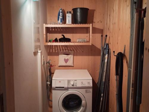 a washer and dryer in a small room at Chalet in Styria near Kreischberg Ski in Sankt Georgen ob Murau