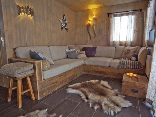 a living room with a couch and a table at Chalet in Stadl an der Mur Styria with sauna in Stadl an der Mur