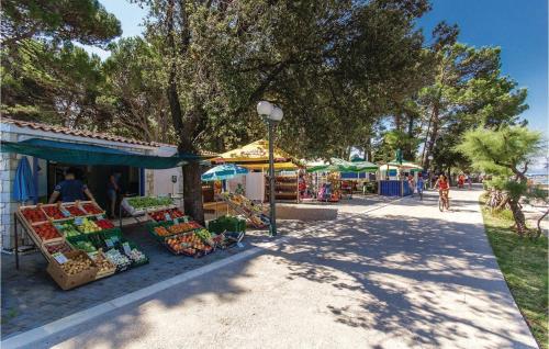 a market with fruits and vegetables on a street at 2 Bedroom Stunning Apartment In Punat in Punat