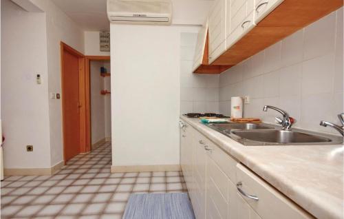 a kitchen with a sink and a counter at Awesome Apartment In Prizba With 1 Bedrooms And Wifi in Prizba