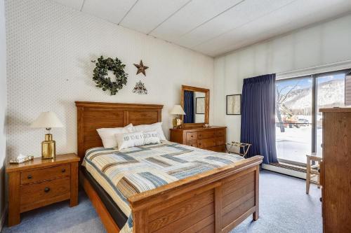 a bedroom with a large bed and a window at Pico C103 in Killington
