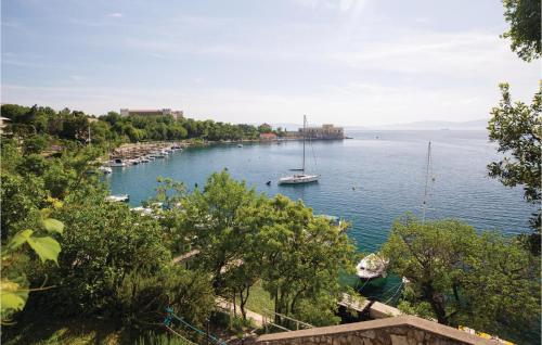 a view of a river with a boat in the water at Amazing Apartment In Kraljevica in Kraljevica