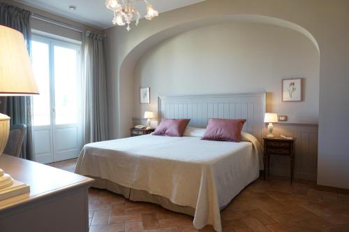 Postel nebo postele na pokoji v ubytování Villa Santa Barbara