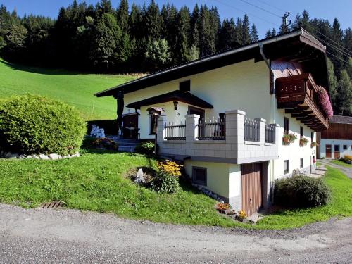 a house with a balcony on the side of it at Beautiful Apartment in Wagrain near Ski Area in Wagrain