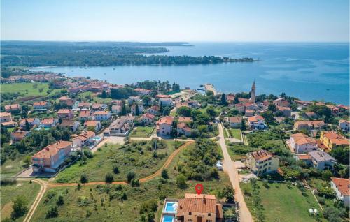 an aerial view of a small town next to a body of water at 3 Bedroom Stunning Home In Lovrecica in Lovrečica