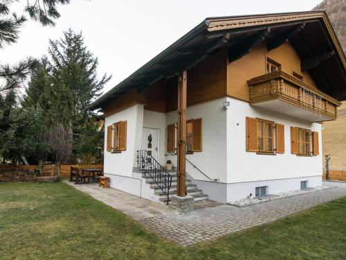 a house with a balcony and a yard at Large holiday home on the Katschberg in Carinthia in Rennweg