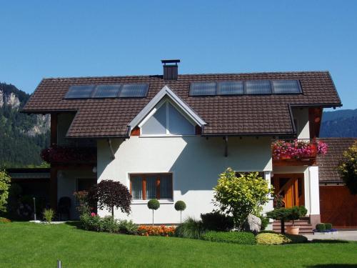 a house with solar panels on the roof at Apartment near the ski area in Vandans in Vandans