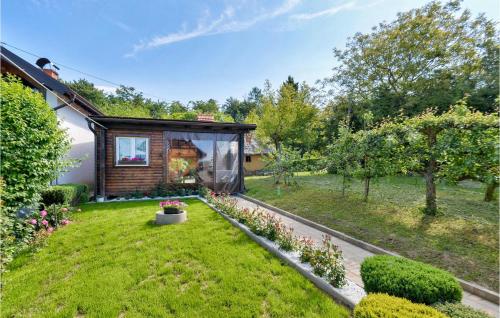 a garden with a small cabin in the middle at Awesome Home In Jalzabet With Kitchen in Jalžabet