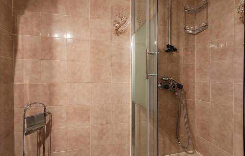 a bathroom with a shower with a glass door at Nice Apartment In Banjole With Wifi in Banjole