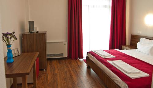 Postel nebo postele na pokoji v ubytování Hotel Hyperion