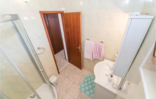 a small bathroom with a shower and a toilet at 2 Bedroom Lovely Apartment In Kustici in Kustići
