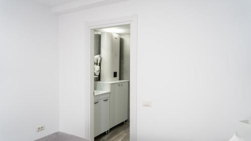 a bathroom with a sink and a mirror at Sea View Apartments Olimp - Avenue Hotels in Olimp