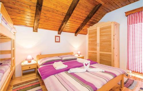 A bed or beds in a room at Cozy Home In Blazevci With Sauna