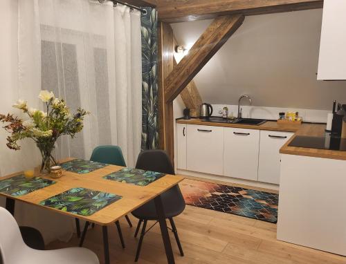 Η κουζίνα ή μικρή κουζίνα στο Apartamenty GUSTO Ostróda