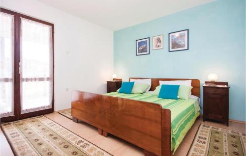 a bedroom with a bed and a large window at Stunning Apartment In Kanica With House Sea View in Sevid