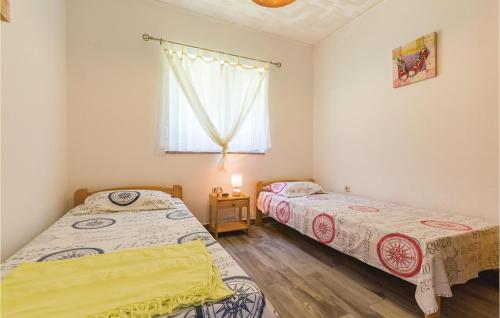 Postel nebo postele na pokoji v ubytování Awesome Apartment In Medulin With 2 Bedrooms And Wifi