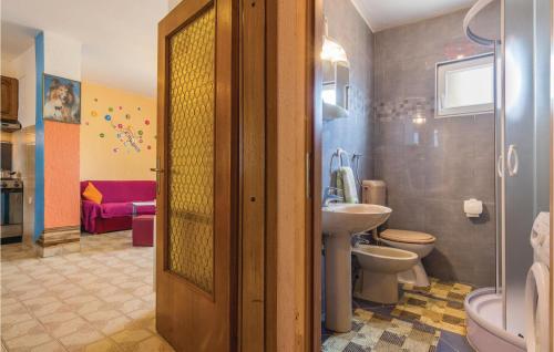 a bathroom with a toilet and a sink at Awesome Apartment In Zminj With 2 Bedrooms And Wifi in Žminj