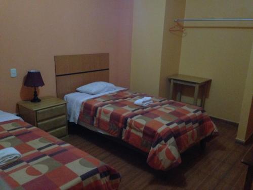 Postel nebo postele na pokoji v ubytování Hotel Sol de Huanchaco