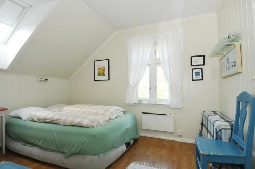 เตียงในห้องที่ Nyksund Apartments Marihaugen