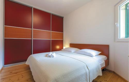 Posteľ alebo postele v izbe v ubytovaní Two-Bedroom Holiday Home