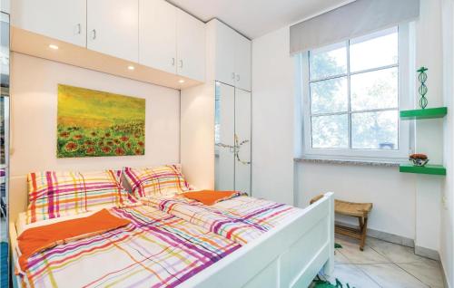 a bedroom with a bed and a window at Awesome Apartment In Rijeka With Wifi in Rijeka