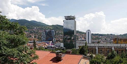 a view of a city with a tall building at Sarajevo Apartments No.5 in Sarajevo